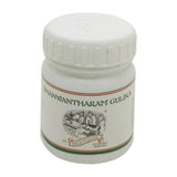 Dhanwantharam Gulika — photographed white bottle